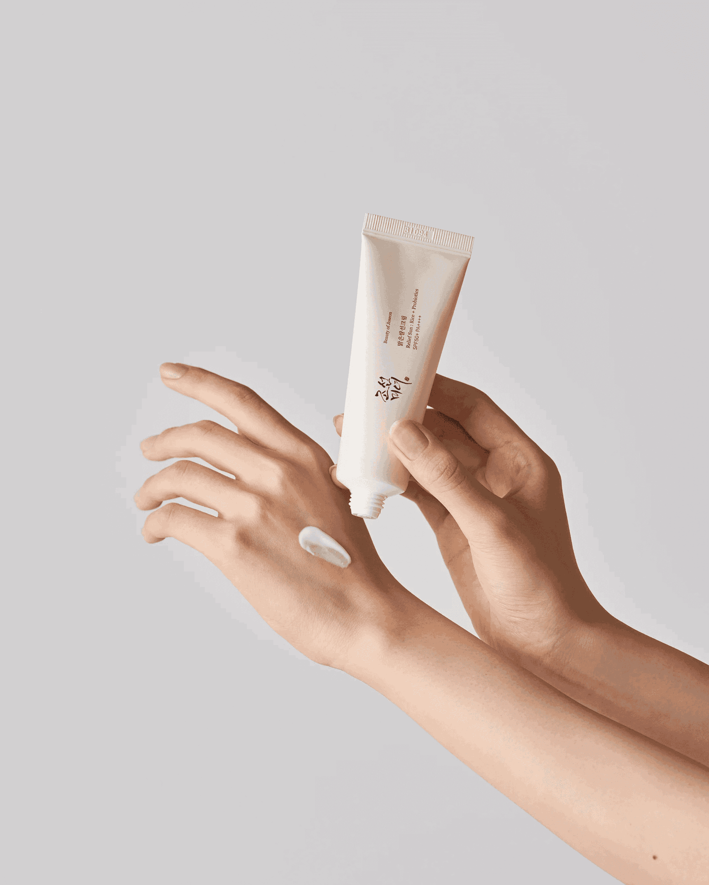 Hand Applying Beauty of Joseon Relief Sun : Rice + Probiotics (SPF50+ PA++++)