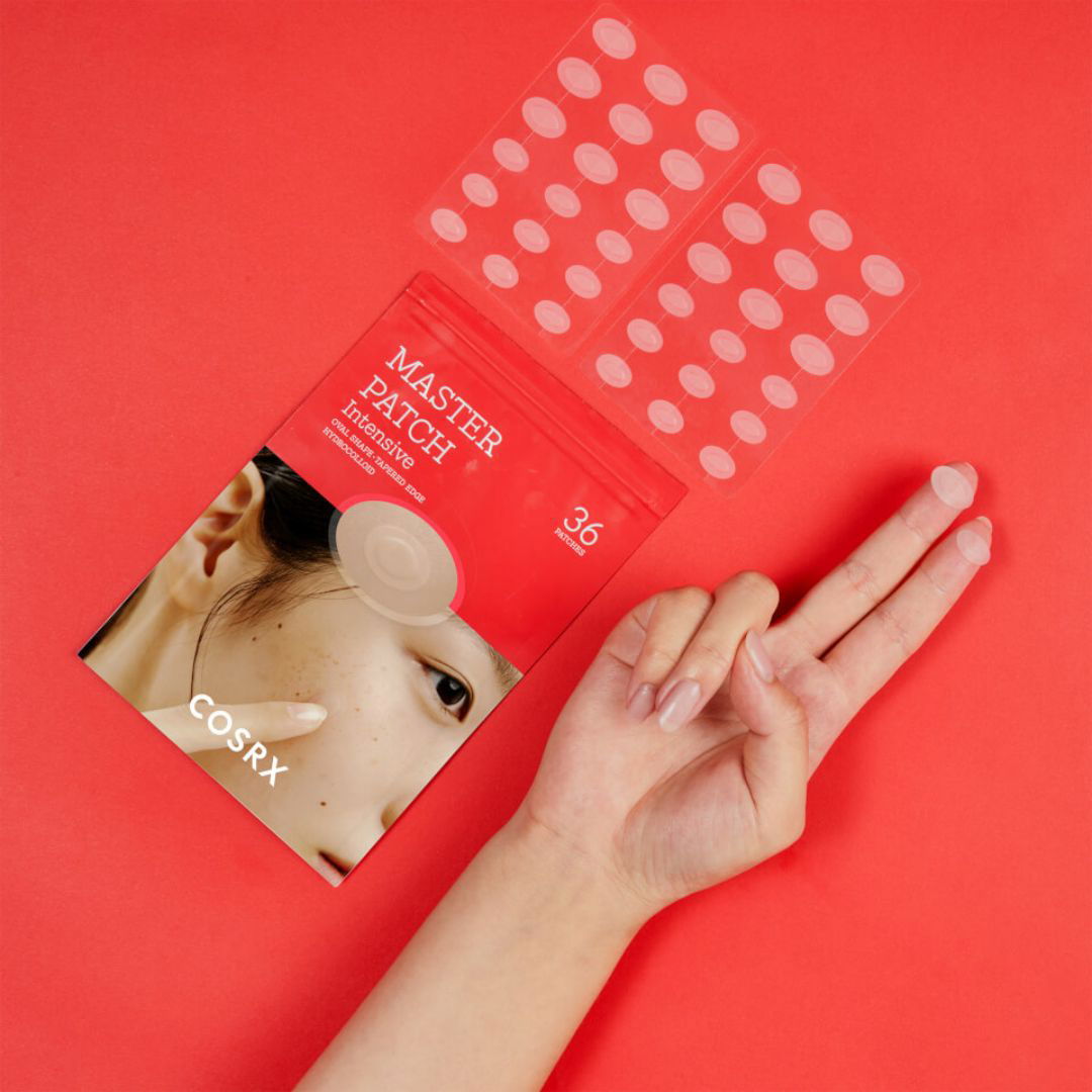 CosRX Master Patch Intensive acne treatment package on a red background