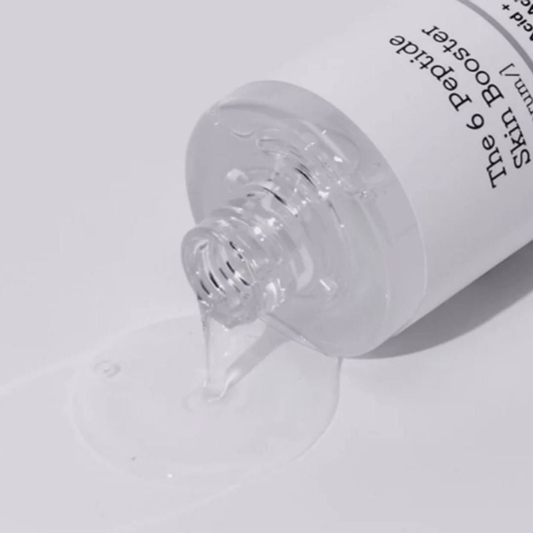 COSRX The 6 Peptide Skin Booster Serum (150ml) serum dropping from bottle