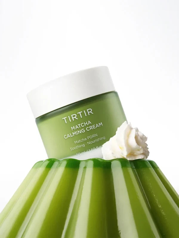 Green jar of TIRTIR Matcha Calming Cream with a white cap on a white background