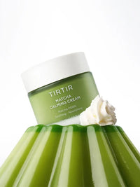 Green jar of TIRTIR Matcha Calming Cream with a white cap on a white background
