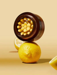 Medicube Deep Vita C Capsule Cream on a lemon 